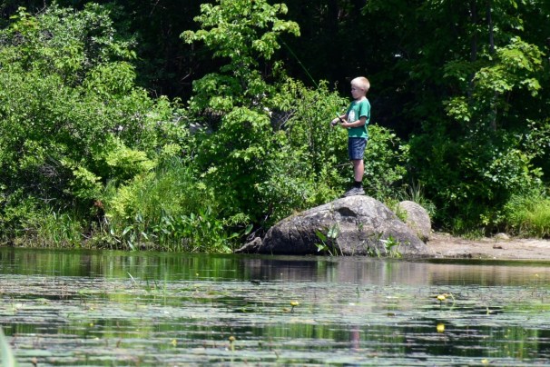 Boy fishing at McDowell Lake in Peterborough, NH